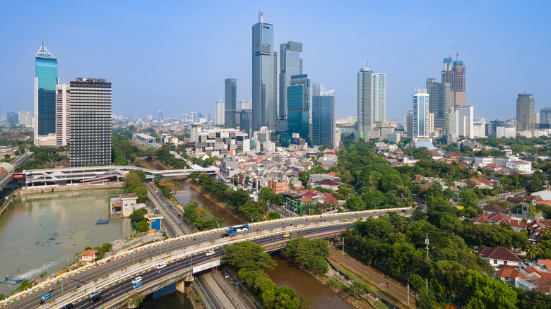 Jakarta, Indonesia skyscrapers and canal