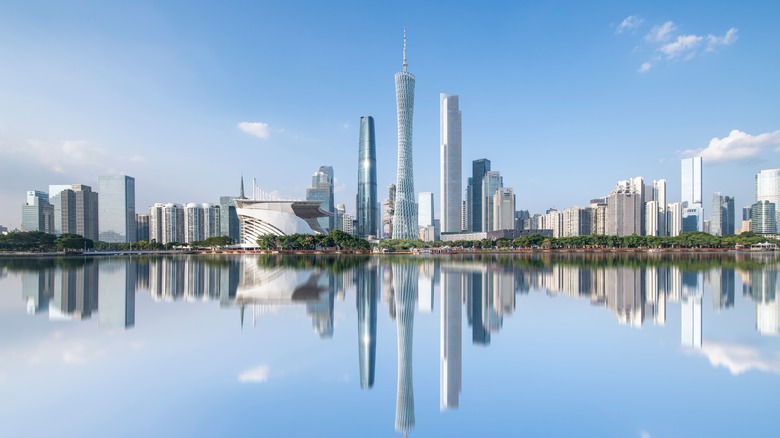 Guangzhou, China skyline reflected in water