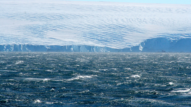 Waves are crashing on ice in Commonwealth Bay