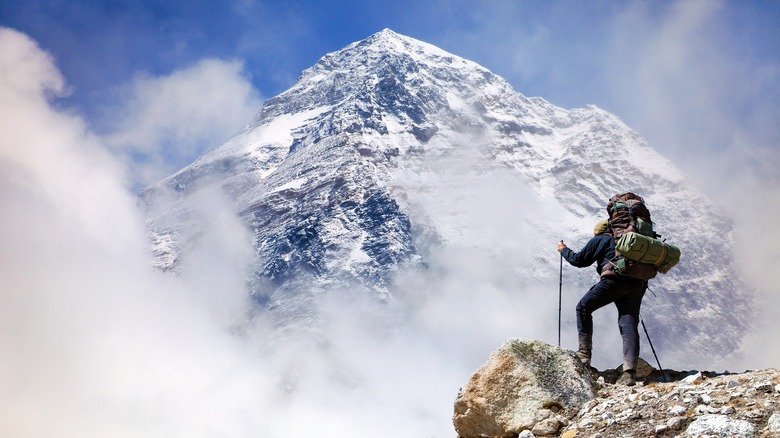 A climber is looking at Mount Everest