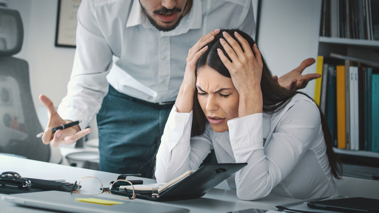 Woman struggling with co-worker's behavior