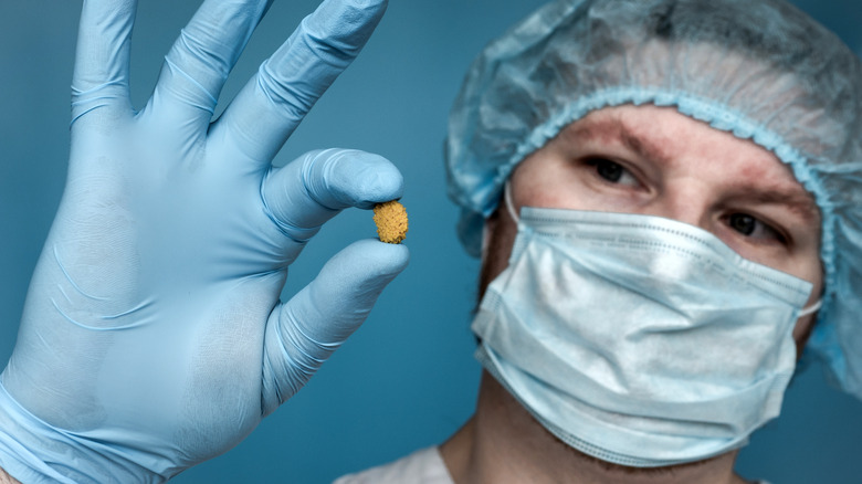 Doctor holding kidney stone