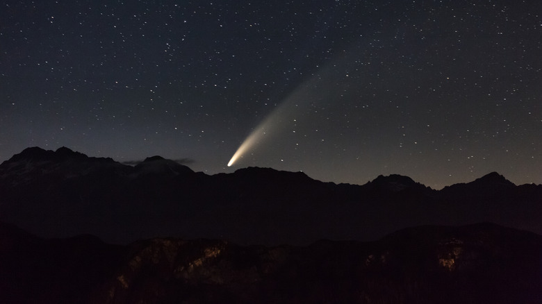 meteor photographed over mountains at night