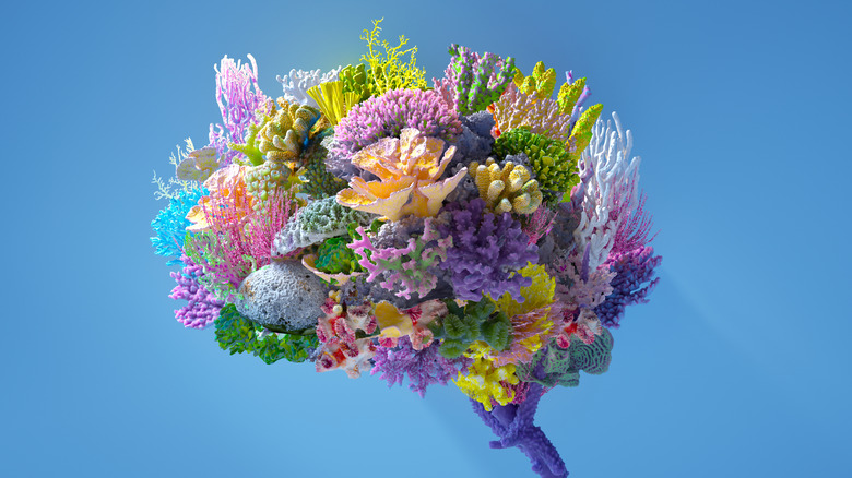 A digital rendering of a brain made up of various growing plants