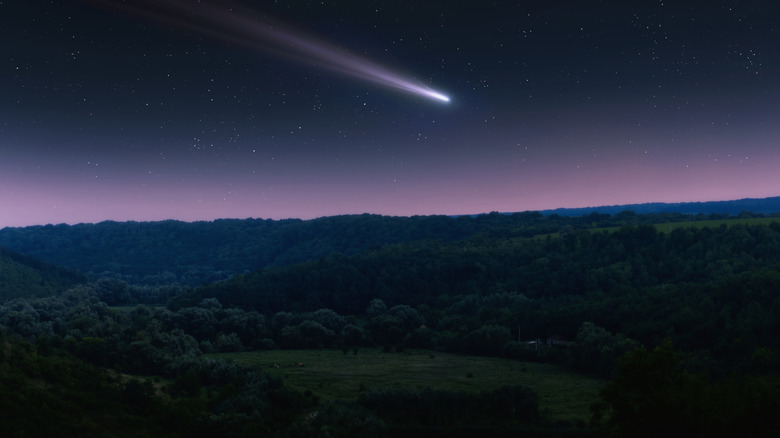 A comet tail seen in the sky from Earth