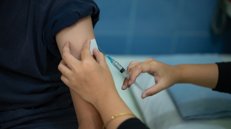 Doctor administering vaccine