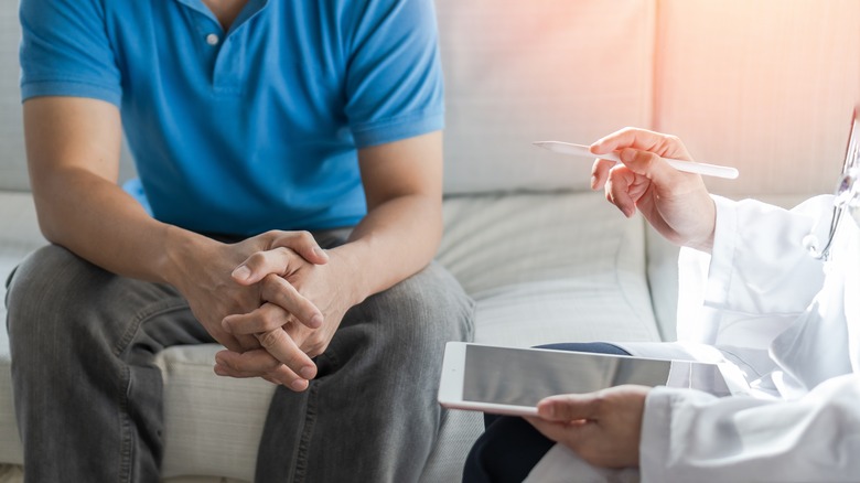 man consulting with doctor