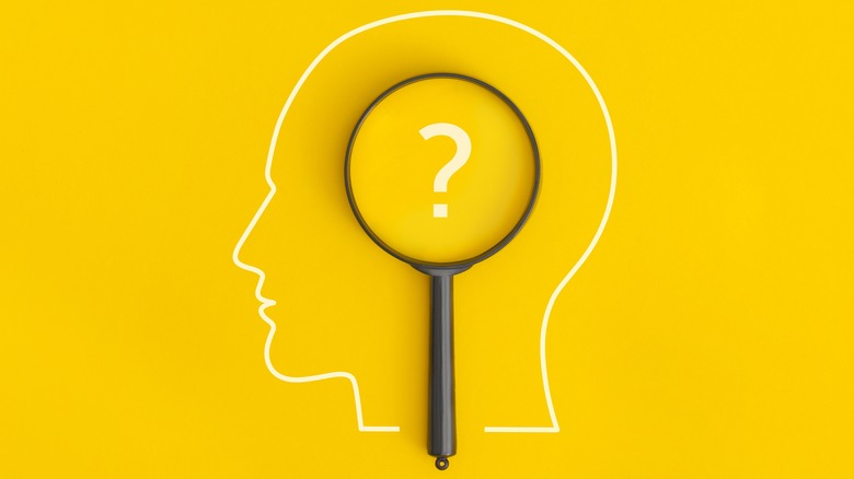 Graphic of head with question mark representing thought analysis