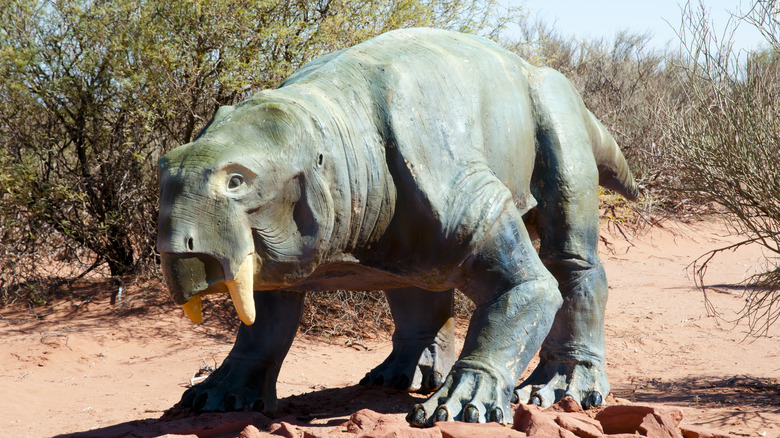 Dicynodont sculpture standing in desert