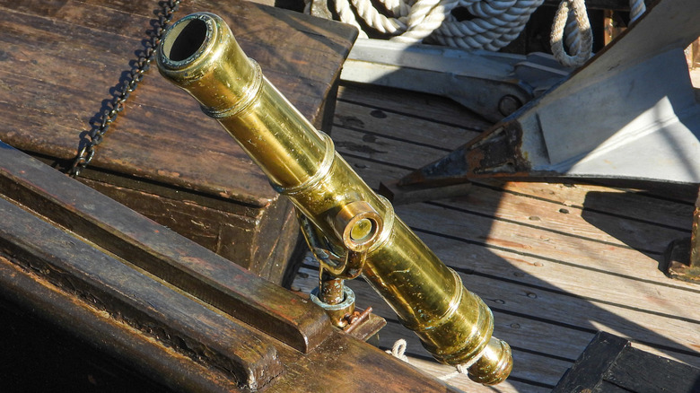 Bronze cannon (similar to the gun found in Arizona) mounted on a sailing ship