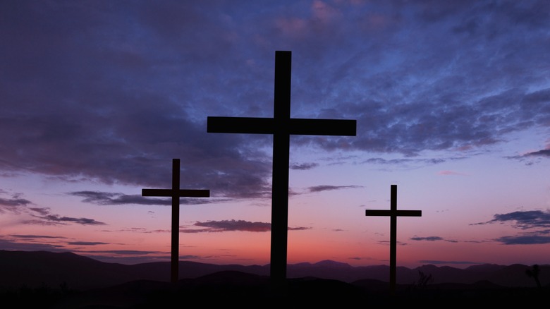 three silhouetted crosses