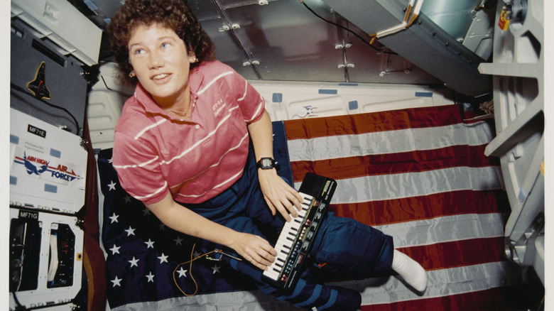 Astronaut playing a keyboard