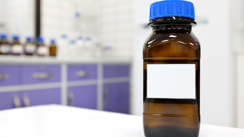 Close-up of an unlabeled reagent bottle in a laboratory