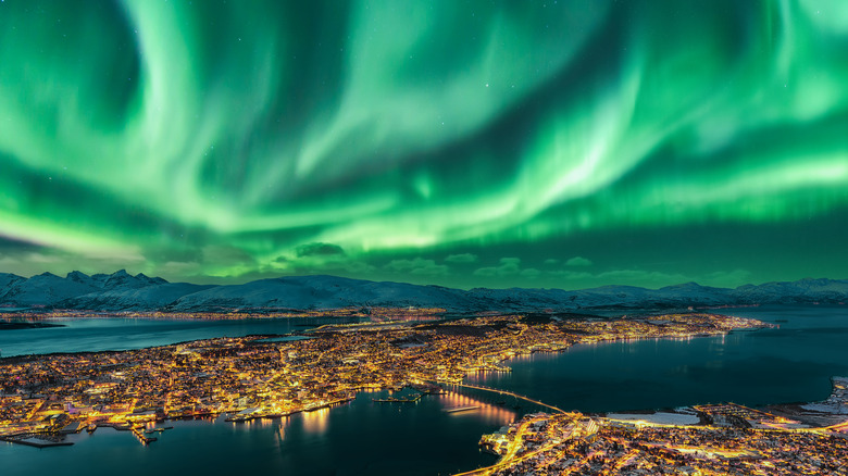 northern lights over city