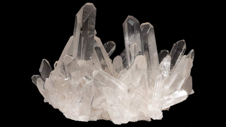 Quartz mineral crystal on black background