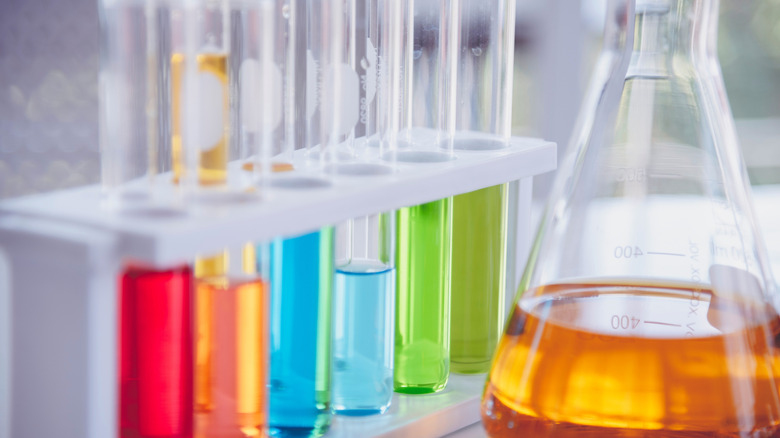 Test tubes and flask filled with colorful liquids