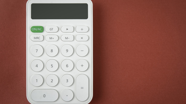 white calculator on red background