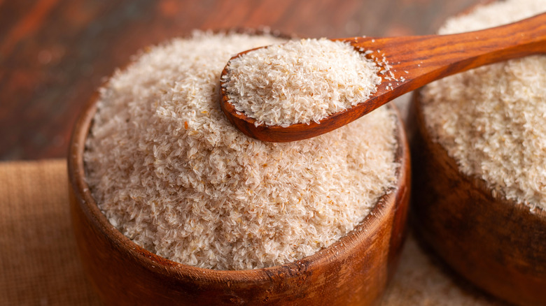 Psyllium husk in wooden bowl with wooden spoon