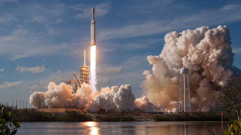 Falcon Heavy rocket taking off from launch pad