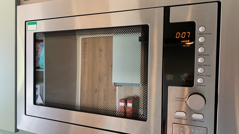 Silver microwave oven with 7 seconds on timer