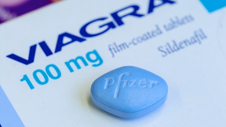 Blue Pfizer Viagra pill up close on box