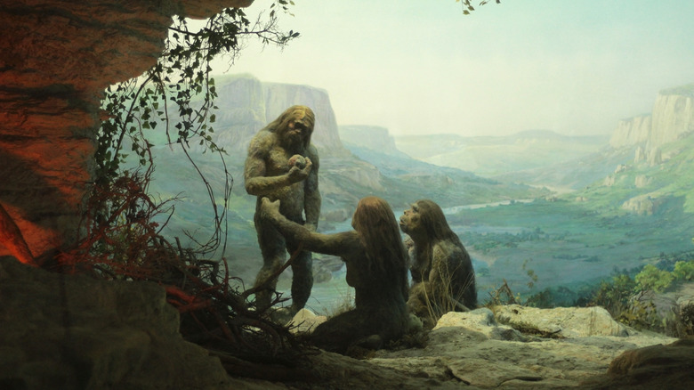 Neanderthals on cliff overlooking valley