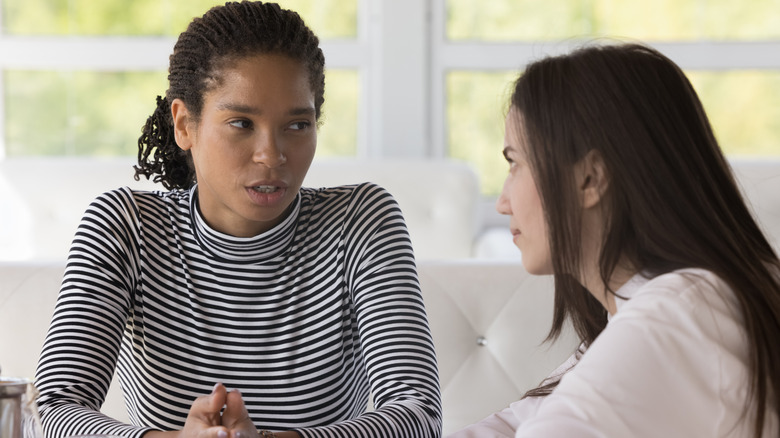 Two women having a serious conversation