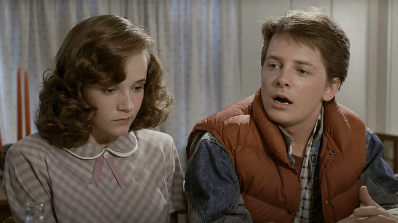 Michael J. Fox's Marty McFly sits alongside Lea Thompson's Lorraine Baines McFly in Back to the Future