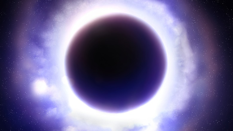 Supermassive black hol with a halo of light around singularity.