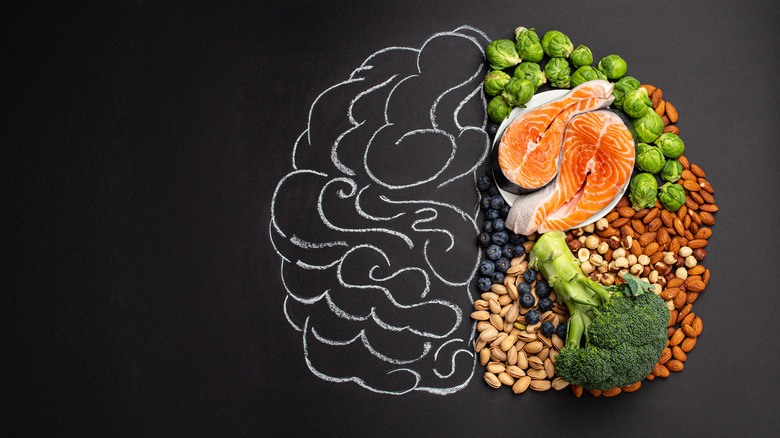 Chalkboard drawing of brain filled in on the right side with healthy foods