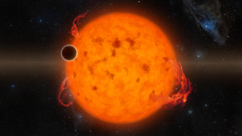 A digital rendering of a planet orbiting a bright red-orange star