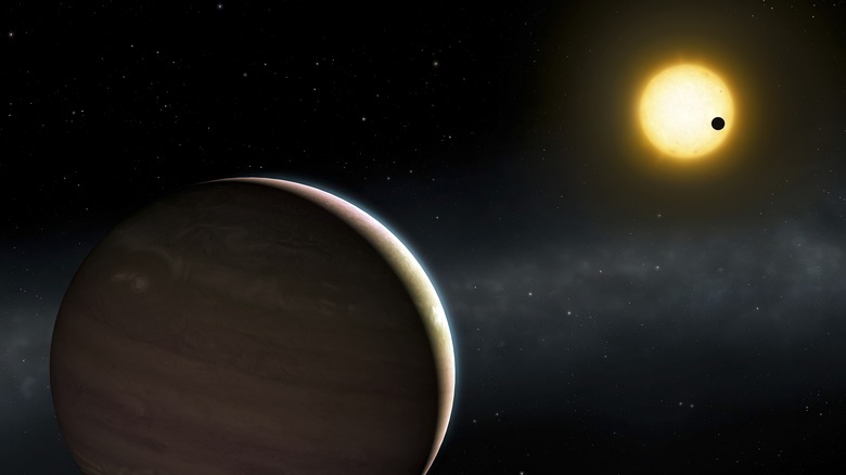 A digital rendering of a gas giant orbiting a yellow star in the distance