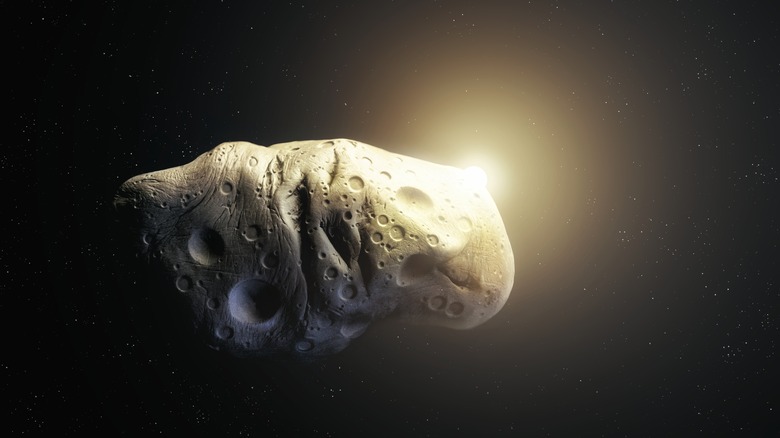 Illustration of asteroid Apophis in dark space with the sun peeking out from behind