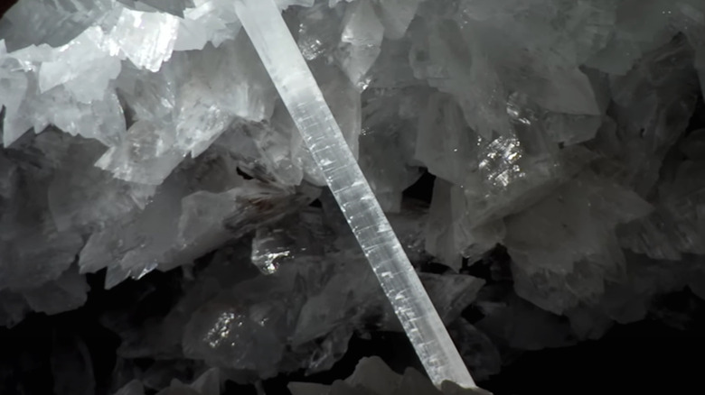 A long thin Selenite crystal is seen illuminated in the Cave of the Crystals as seen in the BBC's How Earth Made Us