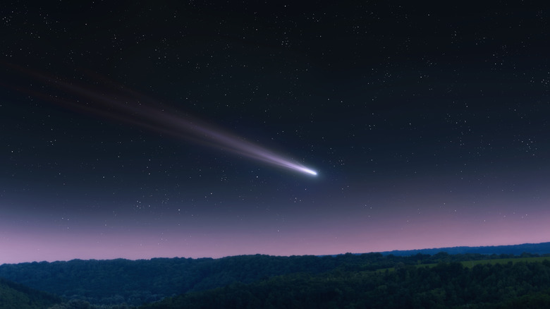 comet against purple night sky