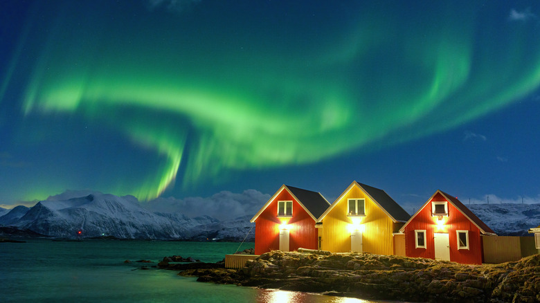 northern lights over cabins