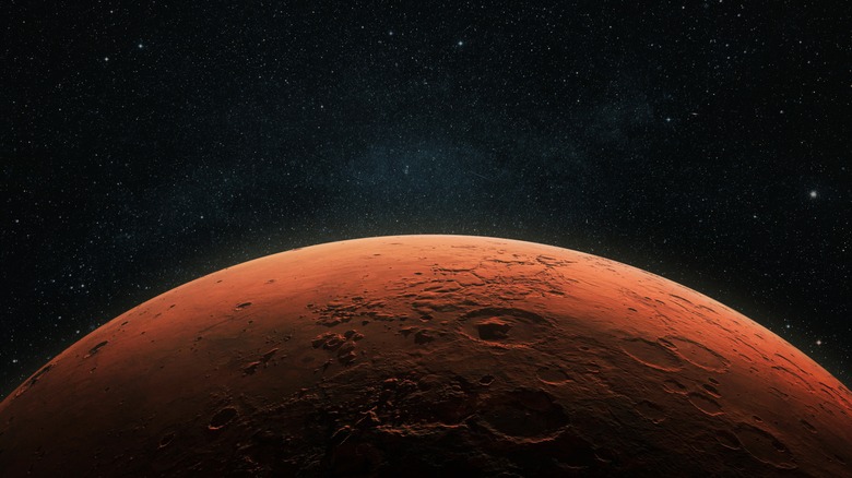 Concept of Mars with craters peaking up into space background