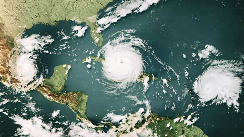 three hurricanes crossing the Gulf of Mexico and Caribbean Sea