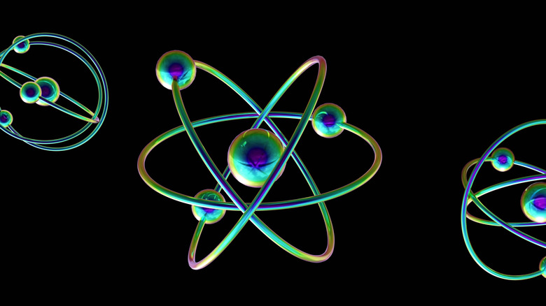 Atomic shapes are shown against a black background