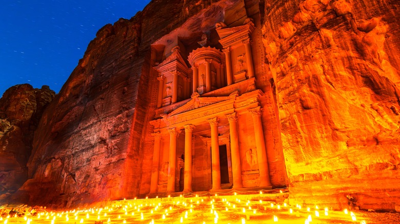 Al-Khazneh in Petra, Jordan, is lit by dozens of lights adorning the entrance