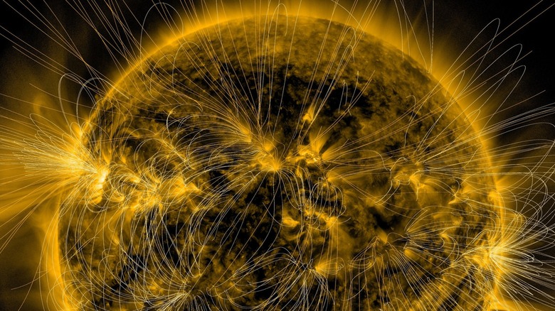 Depiction of the sun's magnetic fields over an image captured by NASA's Solar Dynamics Observatory