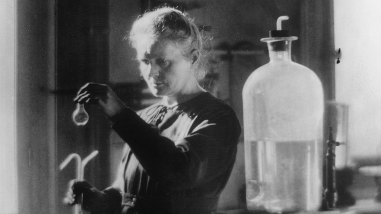 Marie Curie working alone in her lab