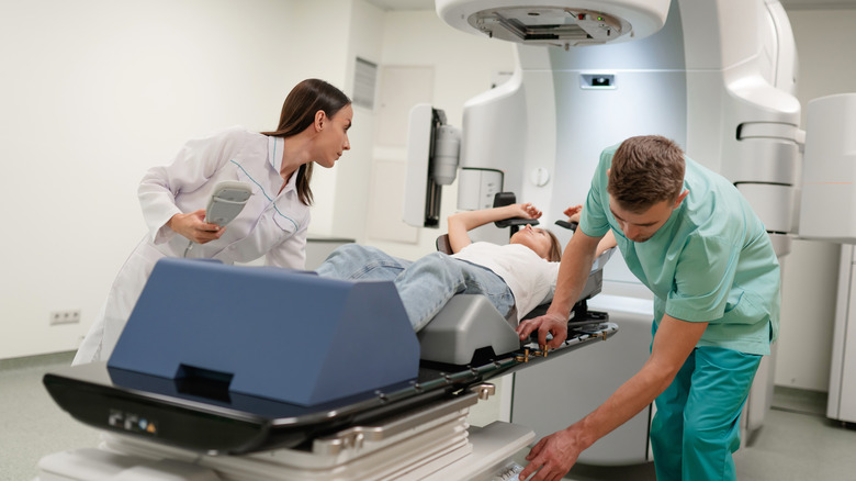 Woman receiving radiotherapy in hospital