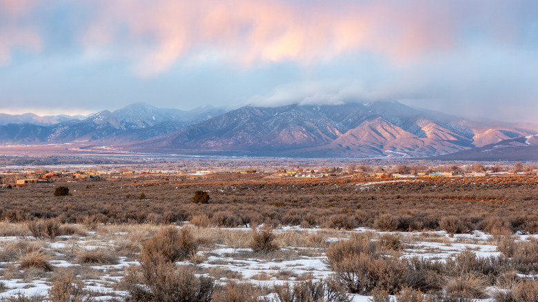 The Taos Valley in New Mexico is seen under a colorful winter sunset