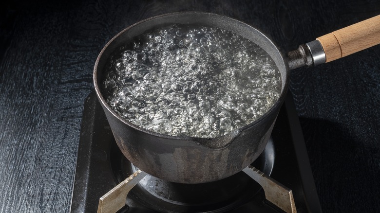 Cast iron pot filled with boiling water