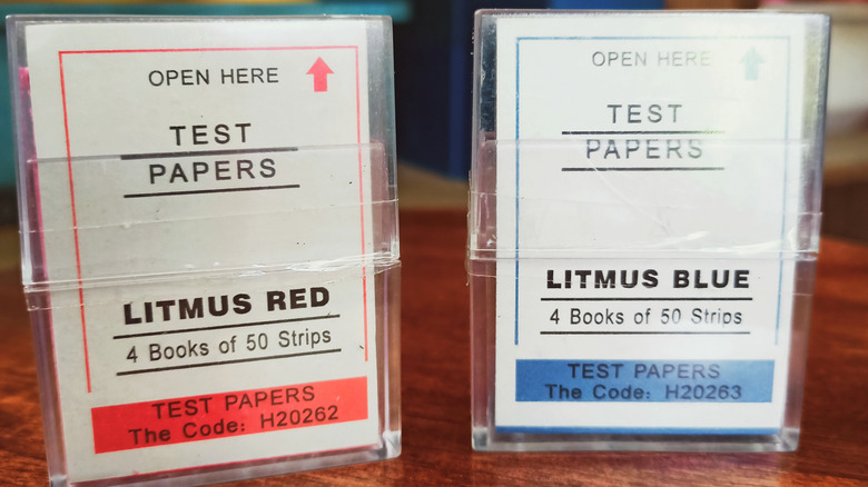 Containers of red and blue litmus paper