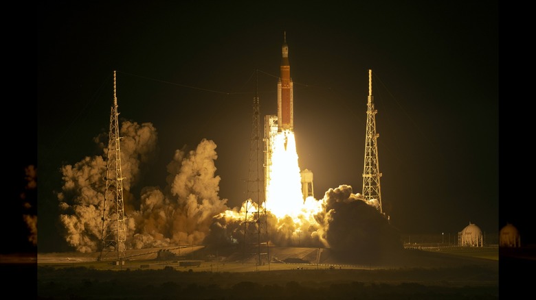 NASA's Artemis I Space Launch System rocket launching at night from Kennedy Space Center in Florida in 2022