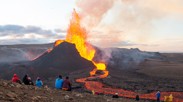 people watching Iceland volcano erupt