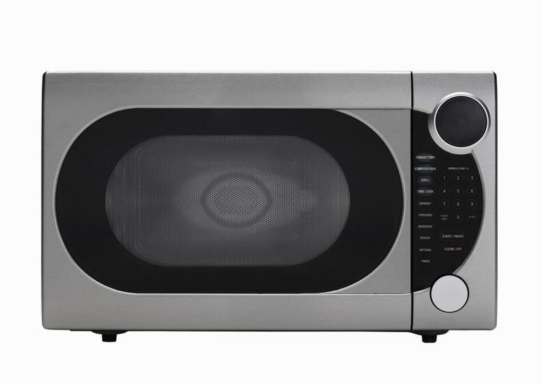 Stainless steel microwave oven on white