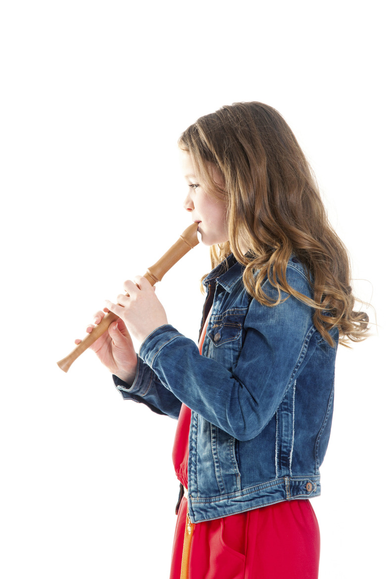 young girl with soprano recorder